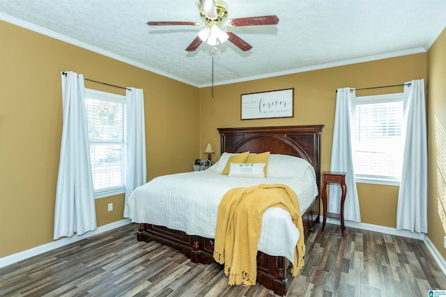 bedroom with dark wood-type flooring, ceiling fan, ornamental molding, and multiple windows