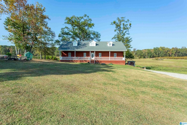 view of front of house with a porch and a front yard