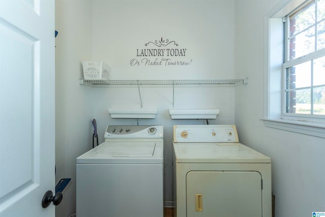 washroom with washing machine and clothes dryer