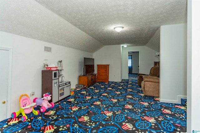 interior space featuring carpet, a textured ceiling, and lofted ceiling