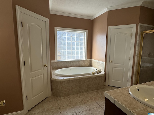 bathroom featuring independent shower and bath, tile patterned flooring, a textured ceiling, vanity, and ornamental molding