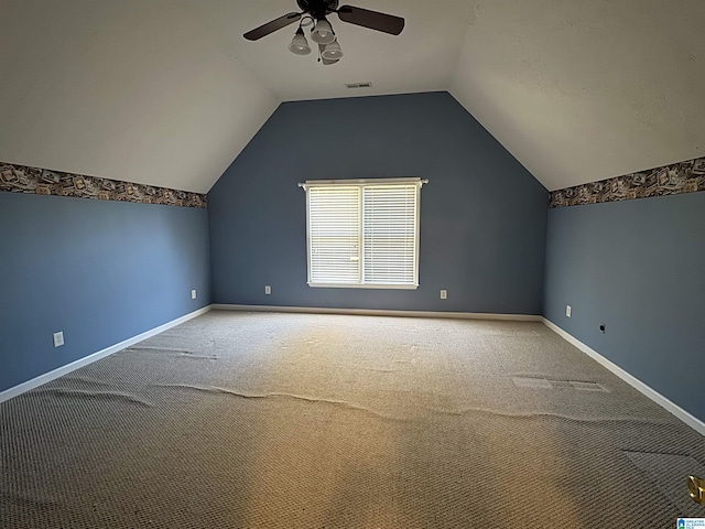 bonus room featuring ceiling fan, carpet, and vaulted ceiling