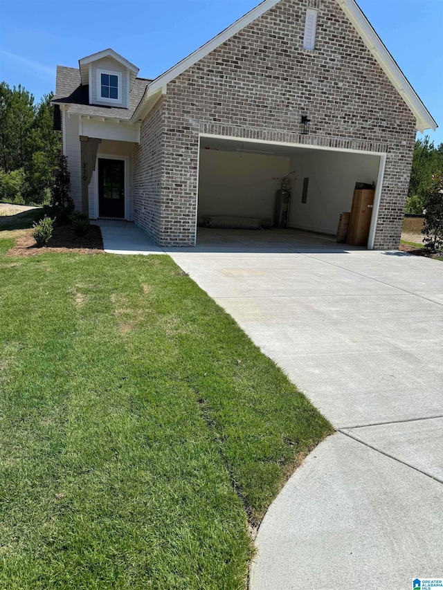 view of front facade with a garage and a front lawn