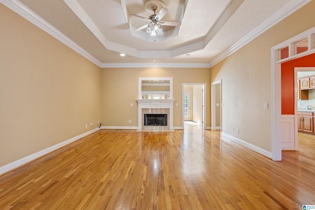 unfurnished living room with crown molding, light hardwood / wood-style floors, and ceiling fan