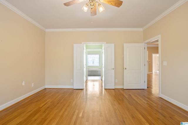 unfurnished room featuring light hardwood / wood-style flooring, ceiling fan, and crown molding