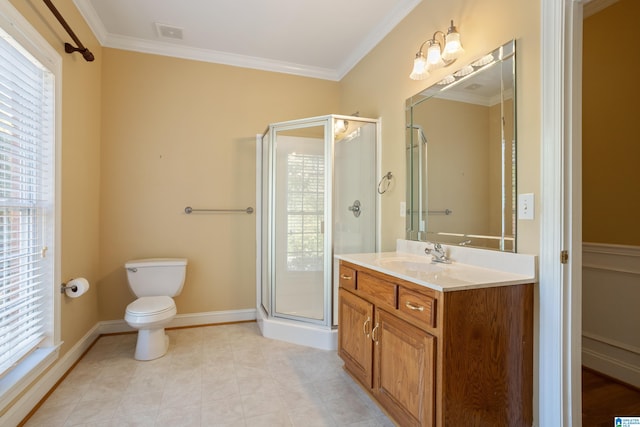 bathroom featuring a shower with door, vanity, ornamental molding, and toilet