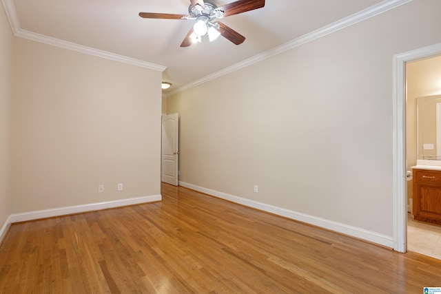 empty room featuring ceiling fan, ornamental molding, and light wood-type flooring