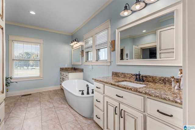 bathroom with vanity, a bathing tub, and ornamental molding