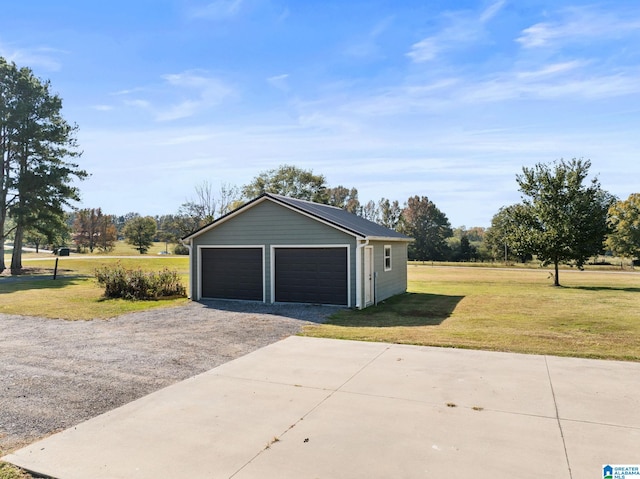 garage with a yard