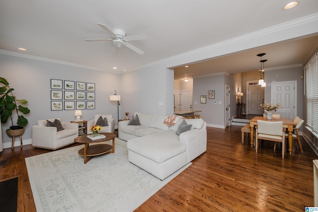 living room featuring crown molding, dark hardwood / wood-style floors, and ceiling fan