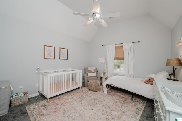 bedroom featuring ceiling fan, vaulted ceiling, and dark colored carpet