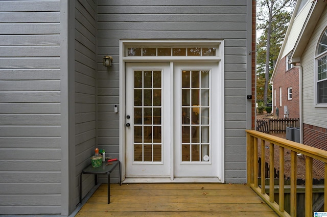 view of exterior entry with a deck