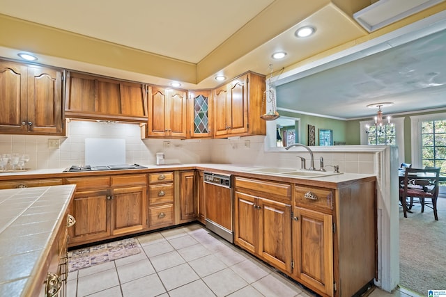 kitchen featuring light tile patterned floors, tile countertops, stainless steel gas stovetop, sink, and paneled dishwasher