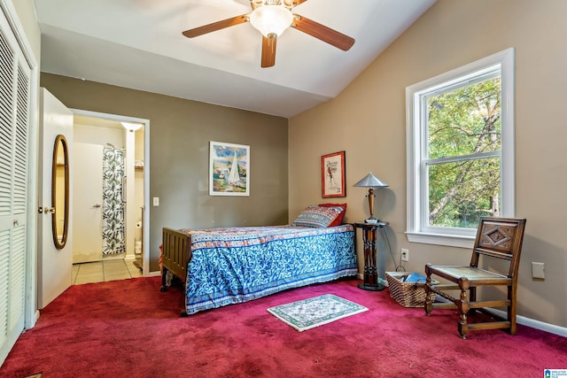 bedroom with multiple windows, light colored carpet, lofted ceiling, and ceiling fan