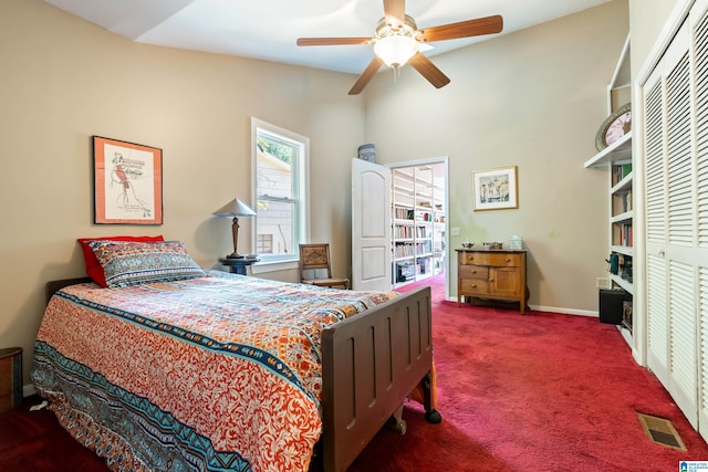 bedroom featuring dark carpet, a closet, and ceiling fan