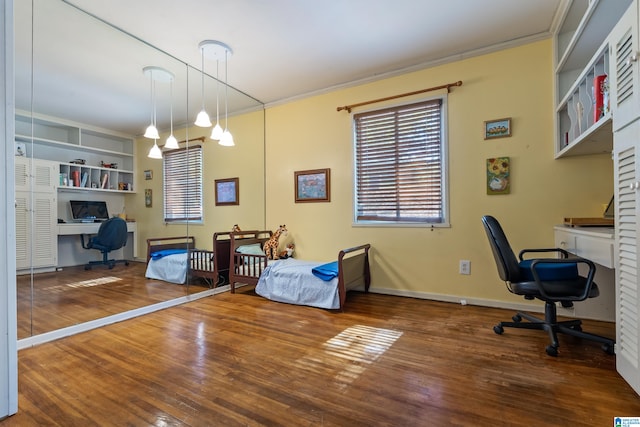 interior space with ornamental molding and dark hardwood / wood-style floors