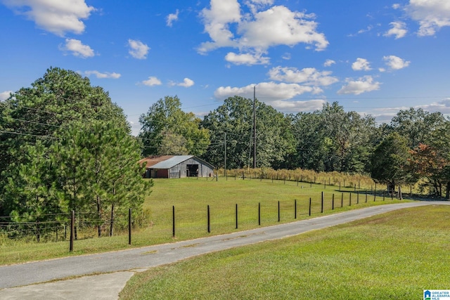 view of yard with a rural view