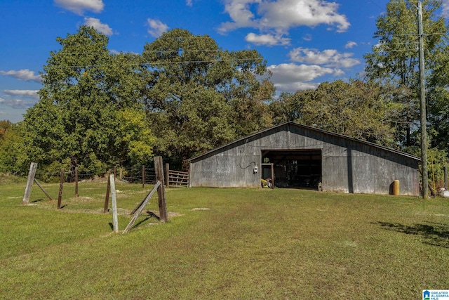 view of outdoor structure with a lawn