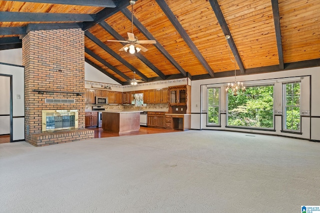 unfurnished living room with beam ceiling, light carpet, a fireplace, and high vaulted ceiling