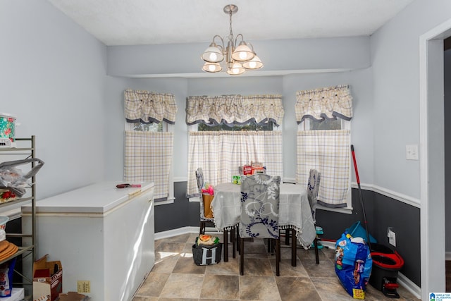 dining area featuring an inviting chandelier