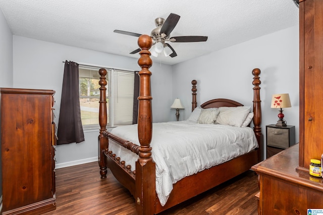 bedroom featuring a textured ceiling, dark wood-type flooring, and ceiling fan