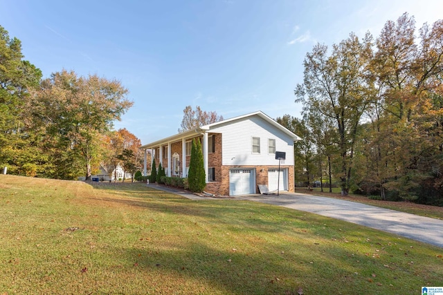 view of side of property with a garage and a lawn