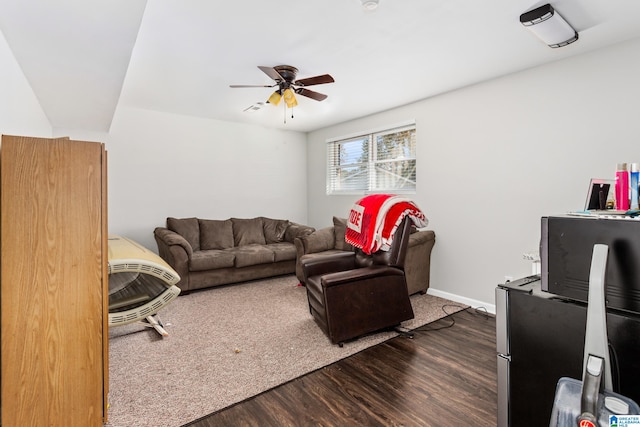 living room featuring hardwood / wood-style floors and ceiling fan