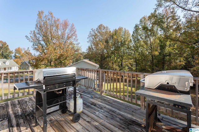 wooden terrace with area for grilling