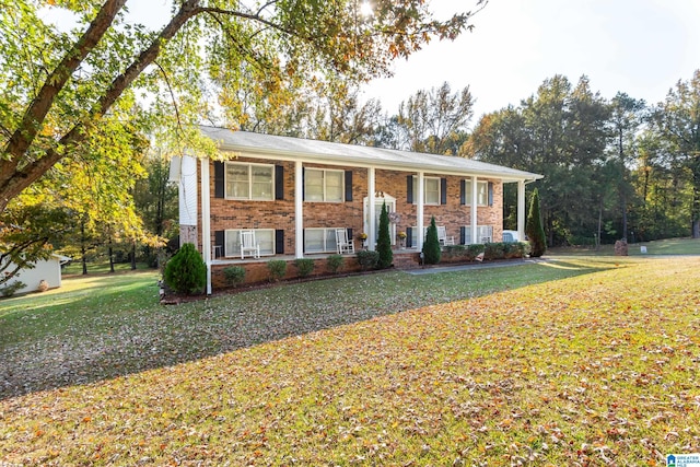 raised ranch with a front yard