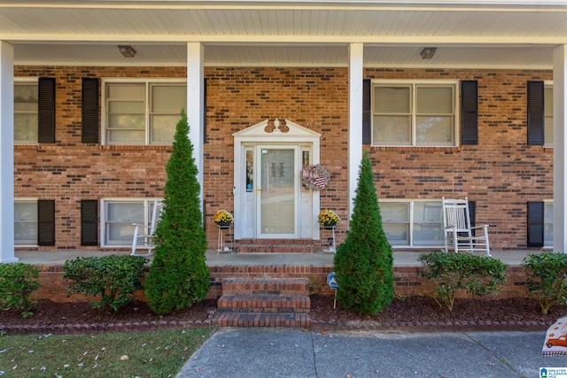 property entrance with covered porch