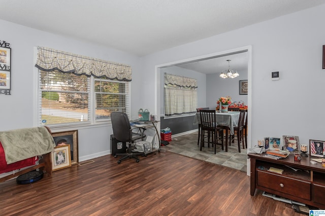 office with a notable chandelier and dark hardwood / wood-style floors