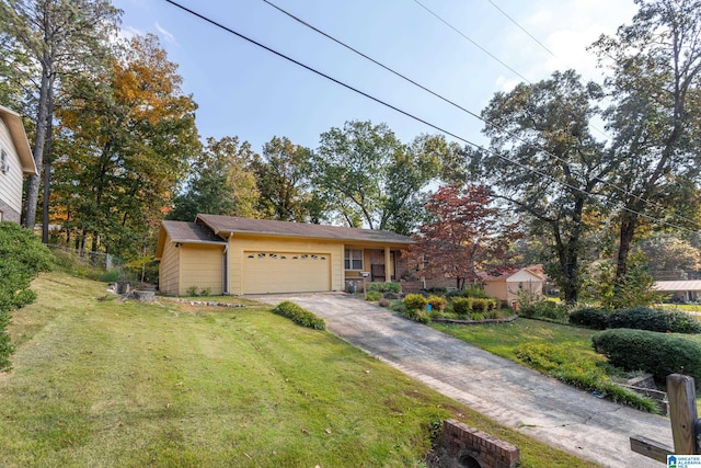 view of front of property featuring a garage and a front lawn