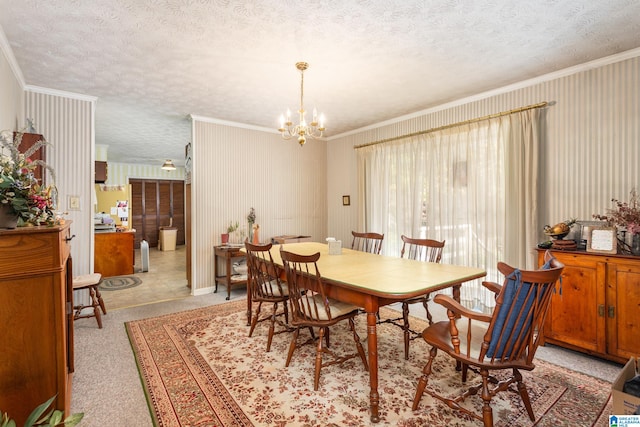 dining room with crown molding, a textured ceiling, and an inviting chandelier