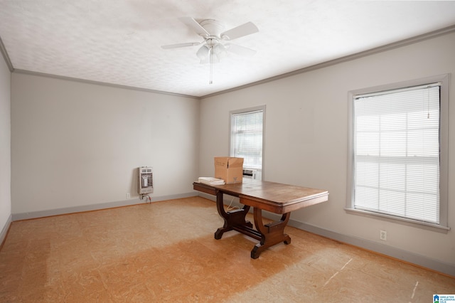 unfurnished office featuring ornamental molding, a textured ceiling, heating unit, and ceiling fan