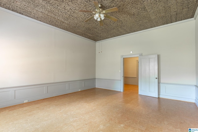 unfurnished room featuring ceiling fan, ornamental molding, and a high ceiling