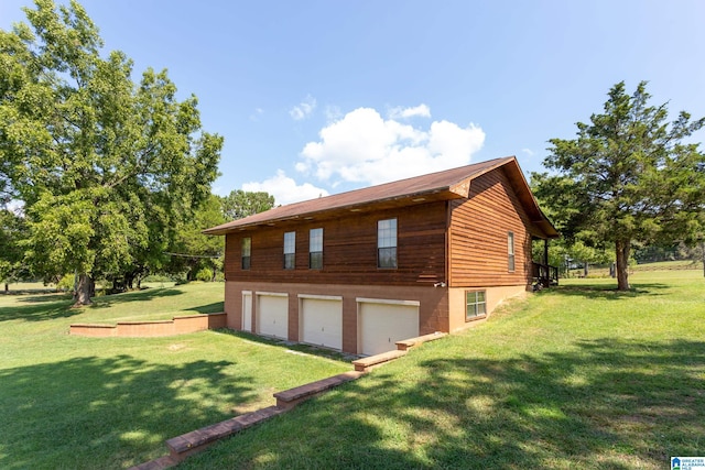 view of home's exterior featuring a lawn and a garage