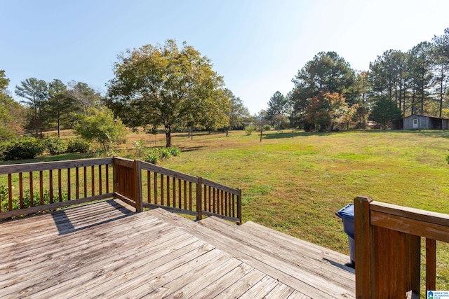 wooden deck with a lawn