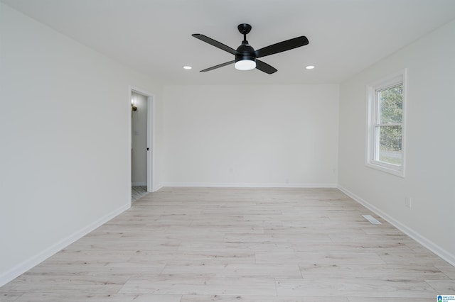 unfurnished room featuring light hardwood / wood-style floors and ceiling fan