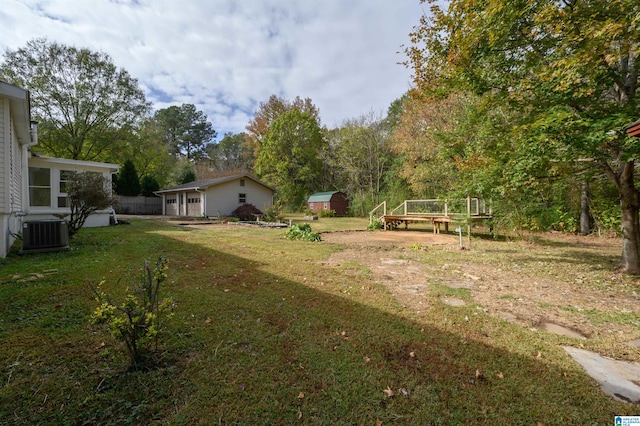 view of yard with central air condition unit