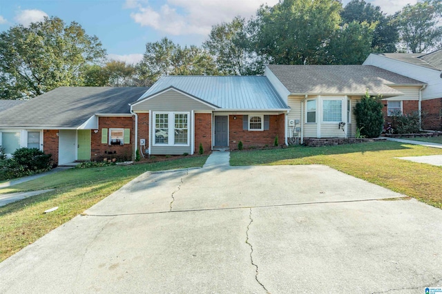 ranch-style house with a front lawn