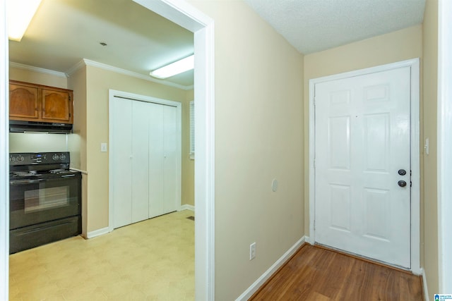 interior space with light hardwood / wood-style flooring and crown molding