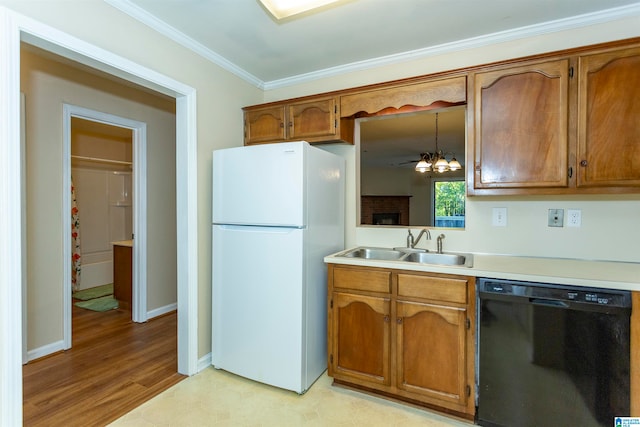 kitchen with black dishwasher, hanging light fixtures, light hardwood / wood-style flooring, ornamental molding, and white fridge