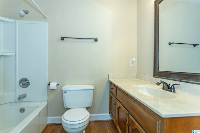 full bathroom featuring vanity, toilet, hardwood / wood-style flooring, and shower / tub combination