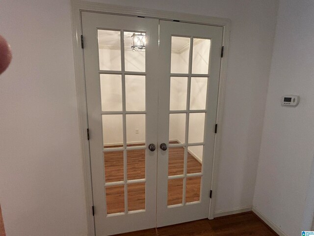 entryway with french doors and dark hardwood / wood-style flooring