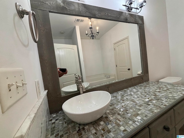 bathroom featuring vanity and an inviting chandelier