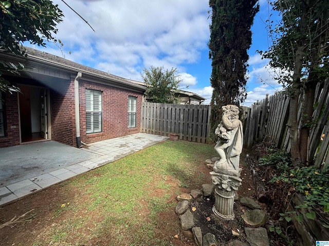 view of yard with a patio area