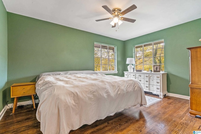 bedroom with dark wood-type flooring and ceiling fan