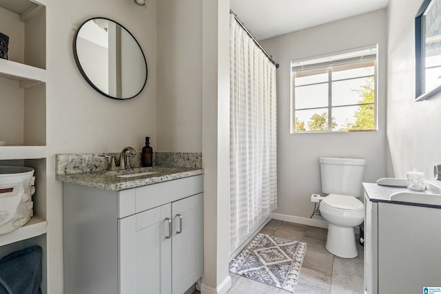 bathroom with vanity, a shower with curtain, and toilet