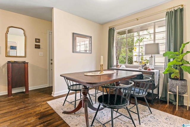 dining area with dark hardwood / wood-style flooring