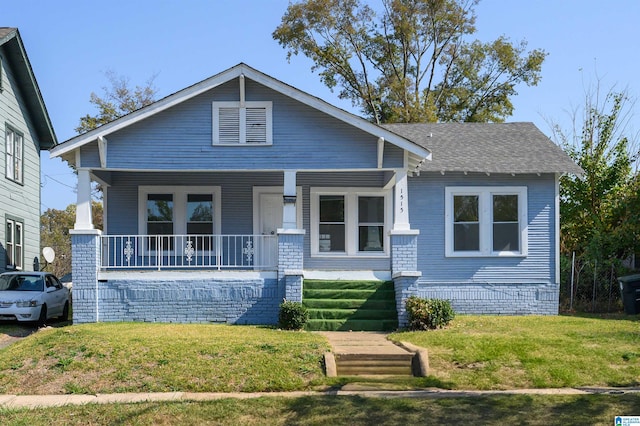 view of front of house featuring a porch and a front yard